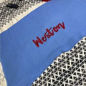 Blue Knit Blanket with Red Embroidery